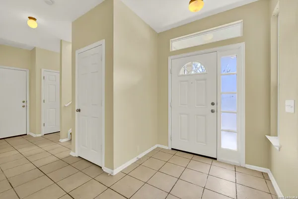 a view of a hallway to rooms