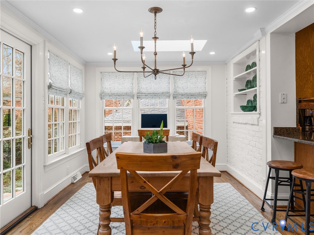8101 Longwood Road Henrico, VA 23229 - Photo 15 of 49 a view of a dining room with furniture window and wooden floor