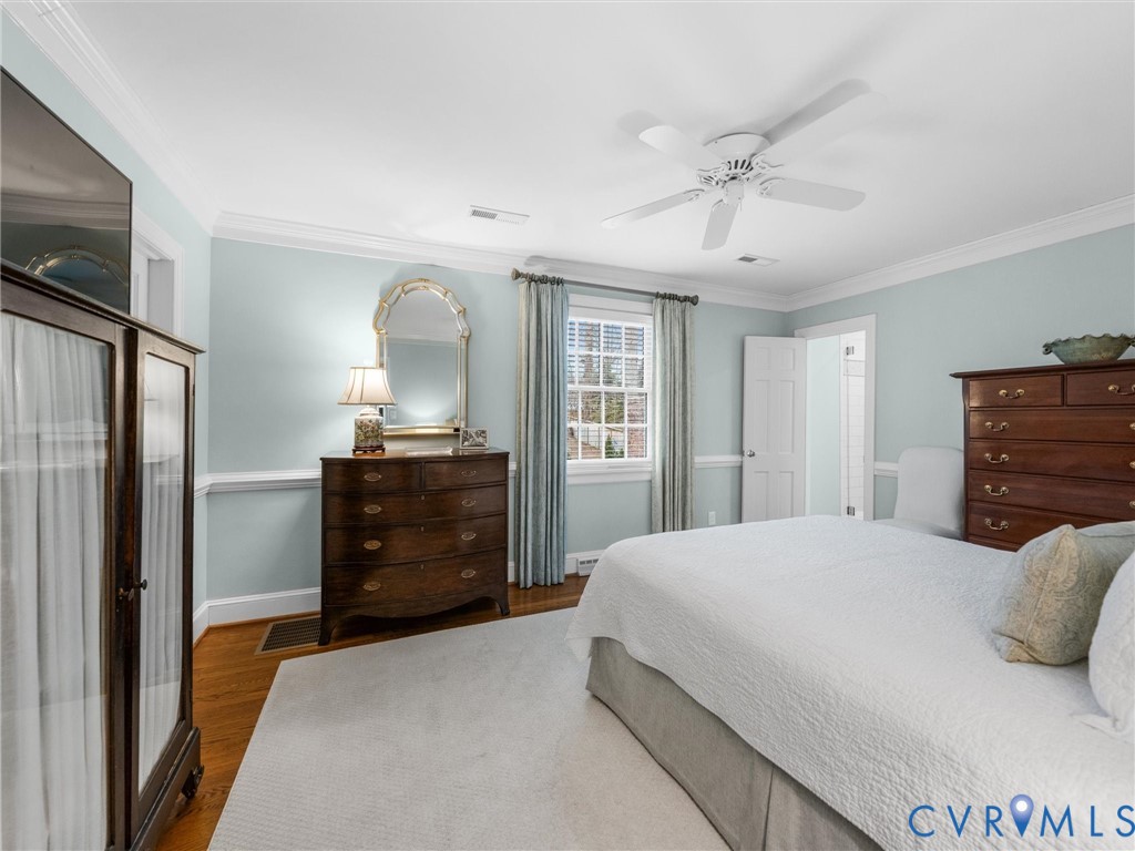 8101 Longwood Road Henrico, VA 23229 - Photo 19 of 49 a bedroom with a bed and a dresser