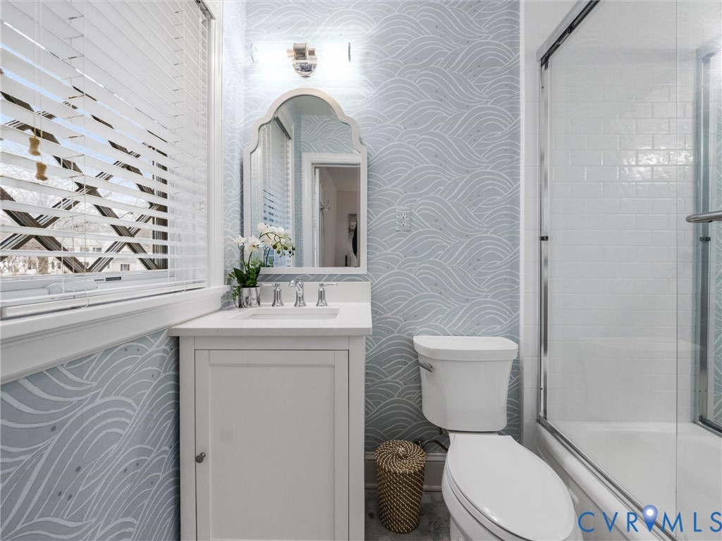 8101 Longwood Road Henrico, VA 23229 - Photo 24 of 49 a bathroom with a granite countertop toilet sink and mirror