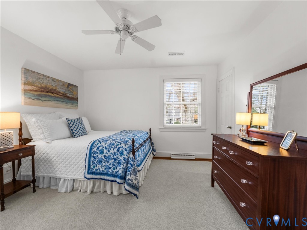 8101 Longwood Road Henrico, VA 23229 - Photo 25 of 49 a bedroom with a bed and a dresser