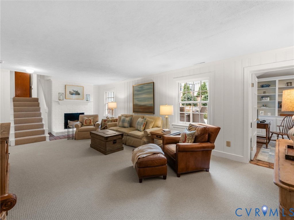 8101 Longwood Road Henrico, VA 23229 - Photo 29 of 49 a living room with furniture and a fireplace