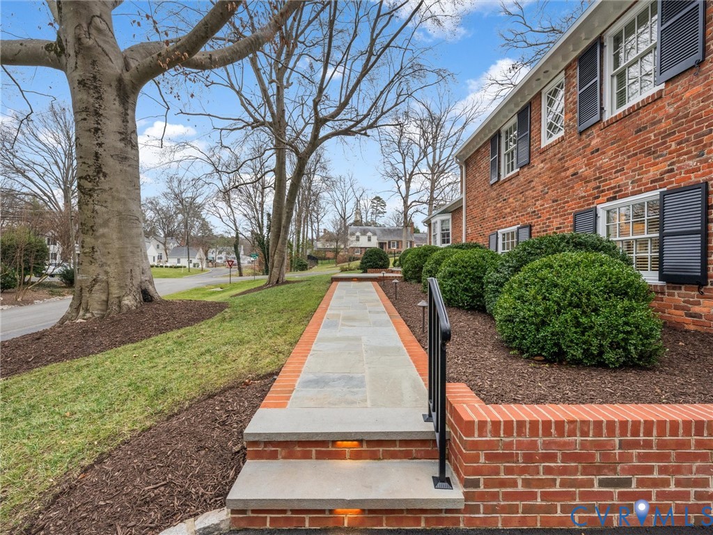 8101 Longwood Road Henrico, VA 23229 - Photo 3 of 49 a view of a yard with plants and trees