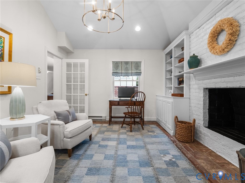 8101 Longwood Road Henrico, VA 23229 - Photo 32 of 49 a living room with furniture a fireplace and a large window