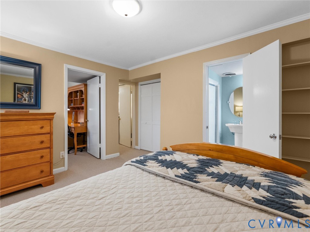8101 Longwood Road Henrico, VA 23229 - Photo 39 of 49 a bedroom with a bed and a dresser