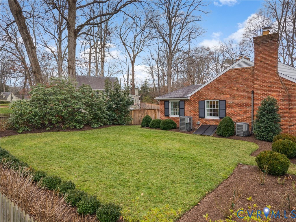 8101 Longwood Road Henrico, VA 23229 - Photo 47 of 49 a front view of a house with a garden