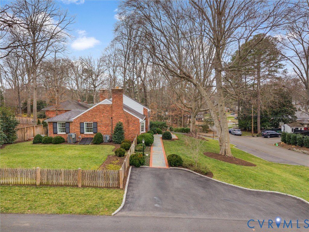 8101 Longwood Road Henrico, VA 23229 - Photo 49 of 49 a front view of a house with a yard and trees
