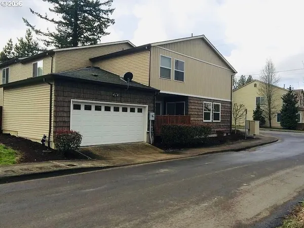 a front view of a house with a garage