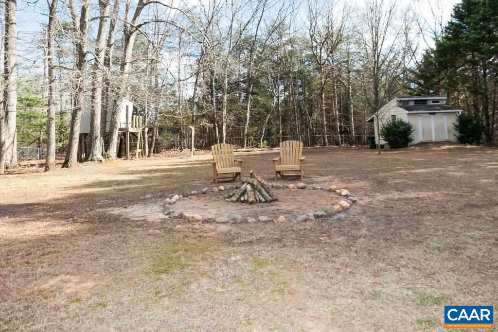 3585 Advance Mills Road Ruckersville, VA 22968 - Photo 11 of 39 a view of a bench in a yard