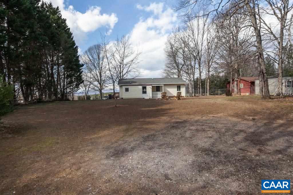 3585 Advance Mills Road Ruckersville, VA 22968 - Photo 12 of 39 a front view of a house with a yard