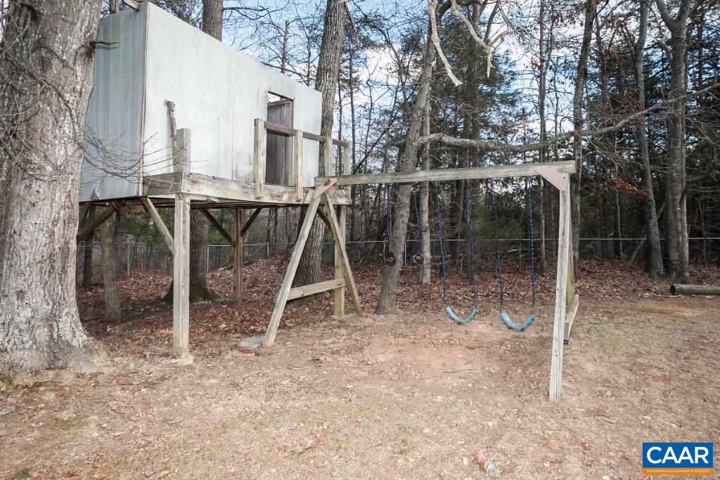 3585 Advance Mills Road Ruckersville, VA 22968 - Photo 15 of 39 a backyard of a house with table and chairs