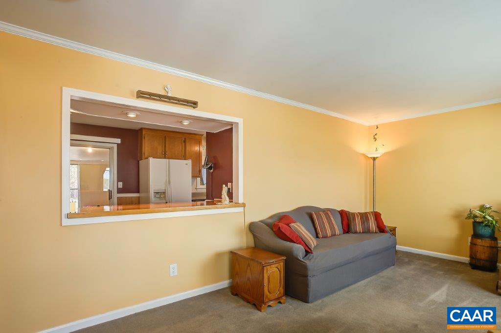 3585 Advance Mills Road Ruckersville, VA 22968 - Photo 16 of 39 a living room with furniture and a window