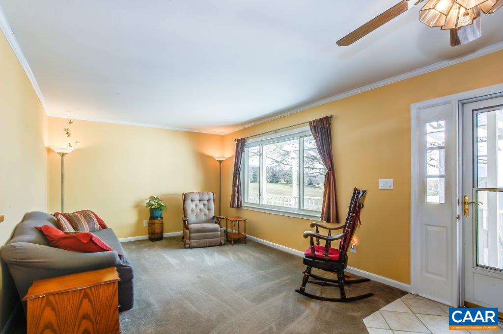 3585 Advance Mills Road Ruckersville, VA 22968 - Photo 17 of 39 a view of a livingroom with lounge chair and a window