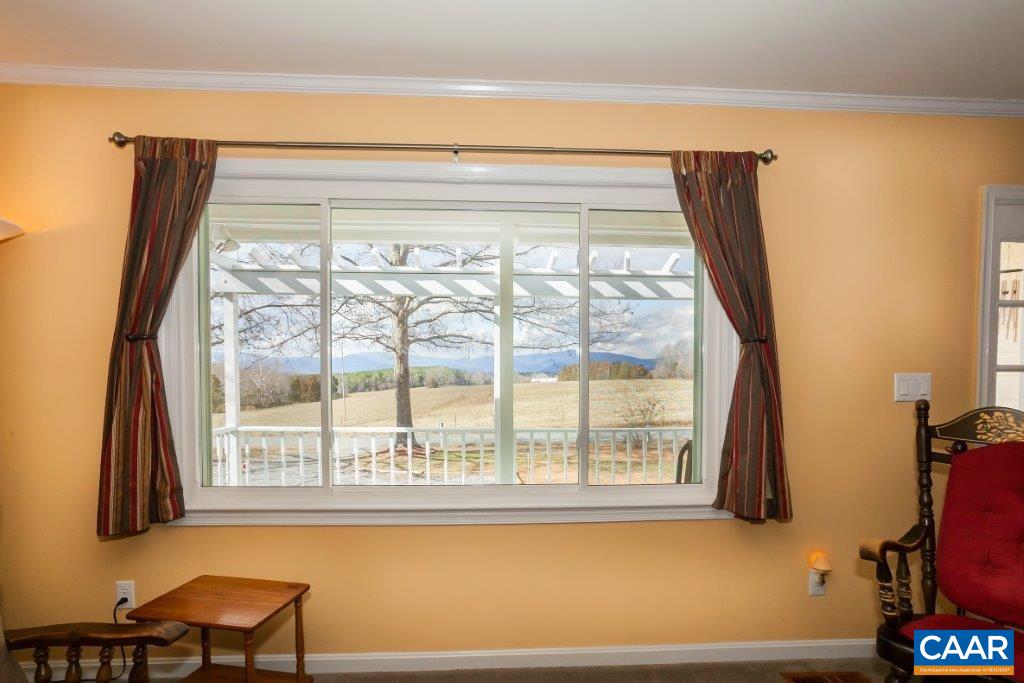 3585 Advance Mills Road Ruckersville, VA 22968 - Photo 19 of 39 a view of a living room and dining room