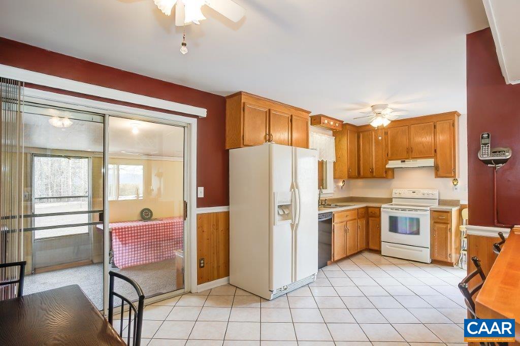 3585 Advance Mills Road Ruckersville, VA 22968 - Photo 22 of 39 a kitchen with stainless steel appliances granite countertop a refrigerator and a stove top oven