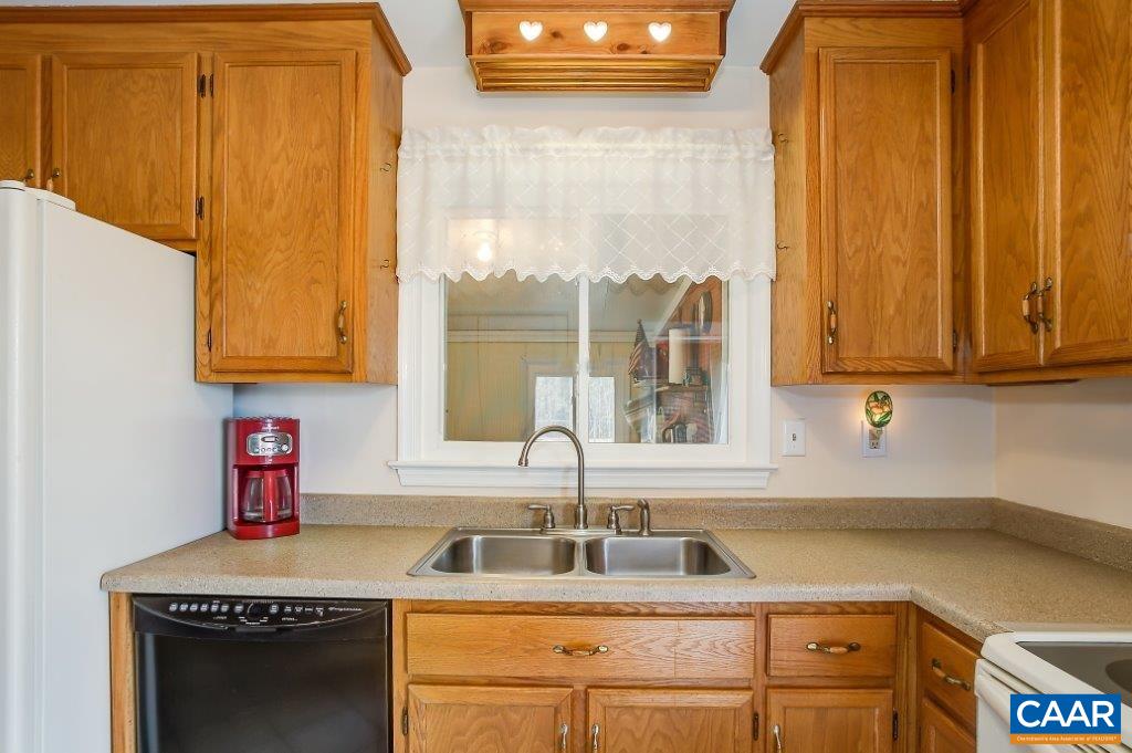 3585 Advance Mills Road Ruckersville, VA 22968 - Photo 24 of 39 a kitchen with stainless steel appliances a sink and a cabinets