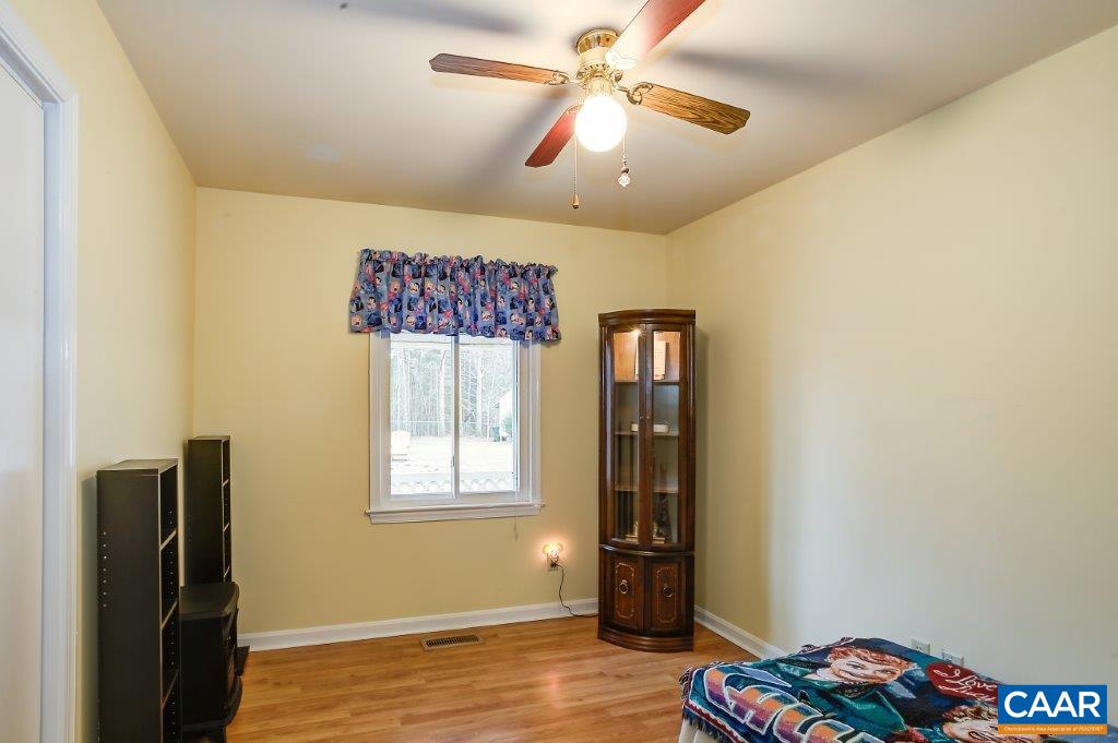 3585 Advance Mills Road Ruckersville, VA 22968 - Photo 35 of 39 a view of workspace with window ceiling fan and wooden floor