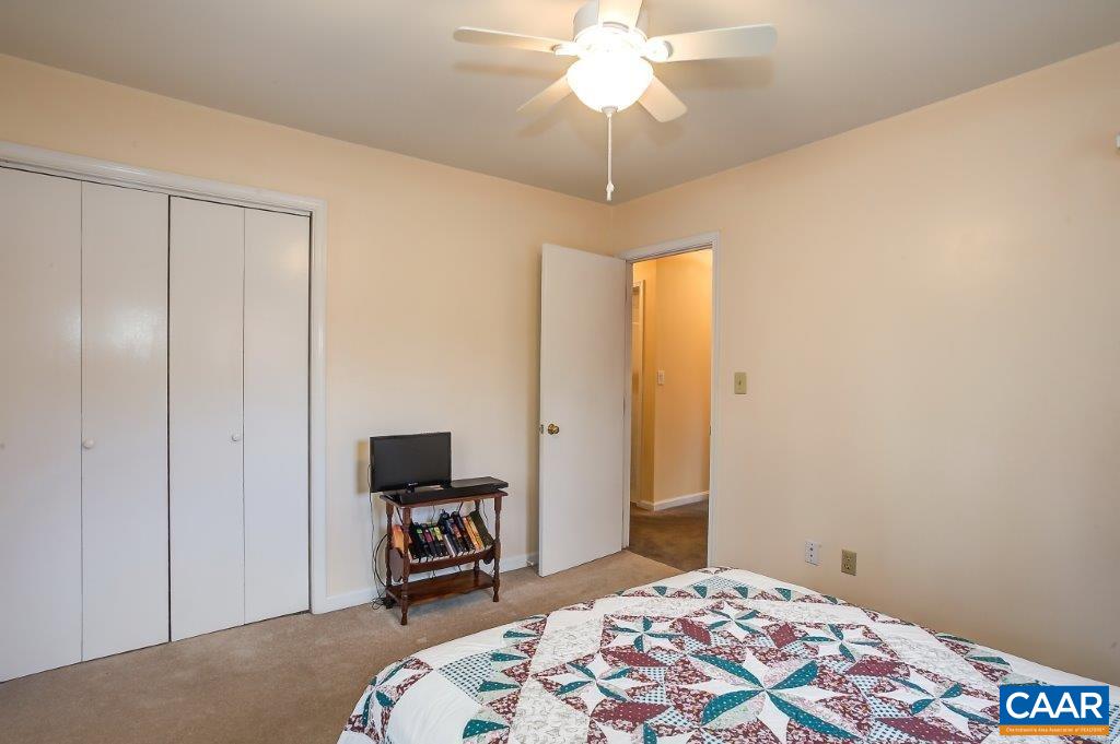 3585 Advance Mills Road Ruckersville, VA 22968 - Photo 39 of 39 a bedroom with a bed and a chair