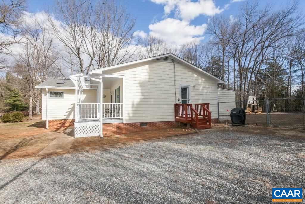 3585 Advance Mills Road Ruckersville, VA 22968 - Photo 6 of 39 a view of a house with a yard and garage