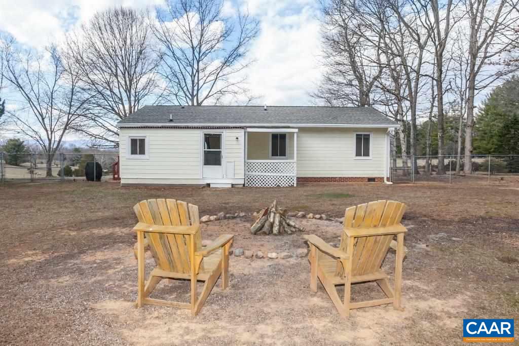 3585 Advance Mills Road Ruckersville, VA 22968 - Photo 8 of 39 a view of a backyard with table and chairs