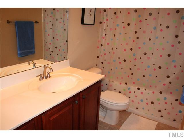 7862 Cape Charles Drive Raleigh, NC 27617 - Photo 12 of 12 a bathroom with a sink toilet and shower