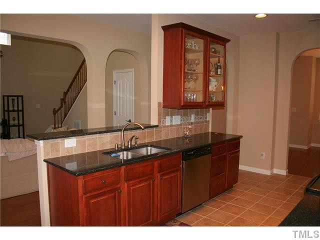 7862 Cape Charles Drive Raleigh, NC 27617 - Photo 6 of 12 a bathroom with a sink and a mirror