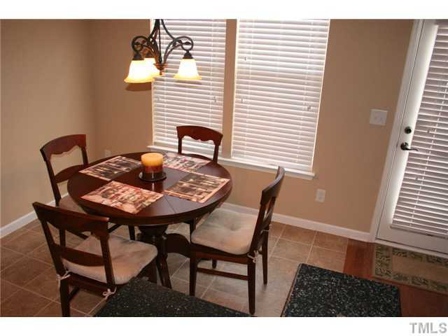 7862 Cape Charles Drive Raleigh, NC 27617 - Photo 7 of 12 a view of a dining room with furniture and window