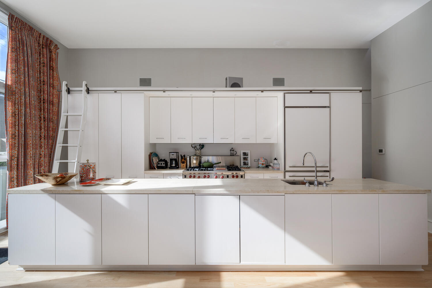 2214 North Burling Street Chicago, IL 60614 - Photo 13 of 29 a kitchen with stainless steel appliances granite countertop a sink a stove and white cabinets with wooden floor