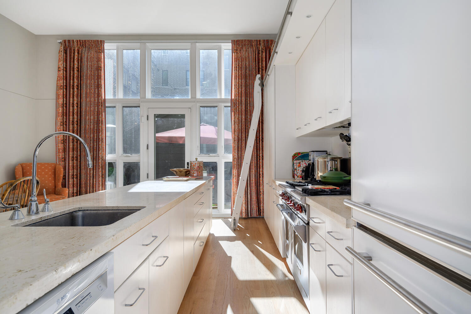 2214 North Burling Street Chicago, IL 60614 - Photo 14 of 29 a kitchen with a sink a counter top space and stainless steel appliances