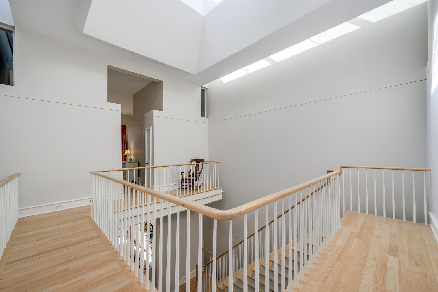 2214 North Burling Street Chicago, IL 60614 - Photo 17 of 29 a view of a hallway with wooden floor
