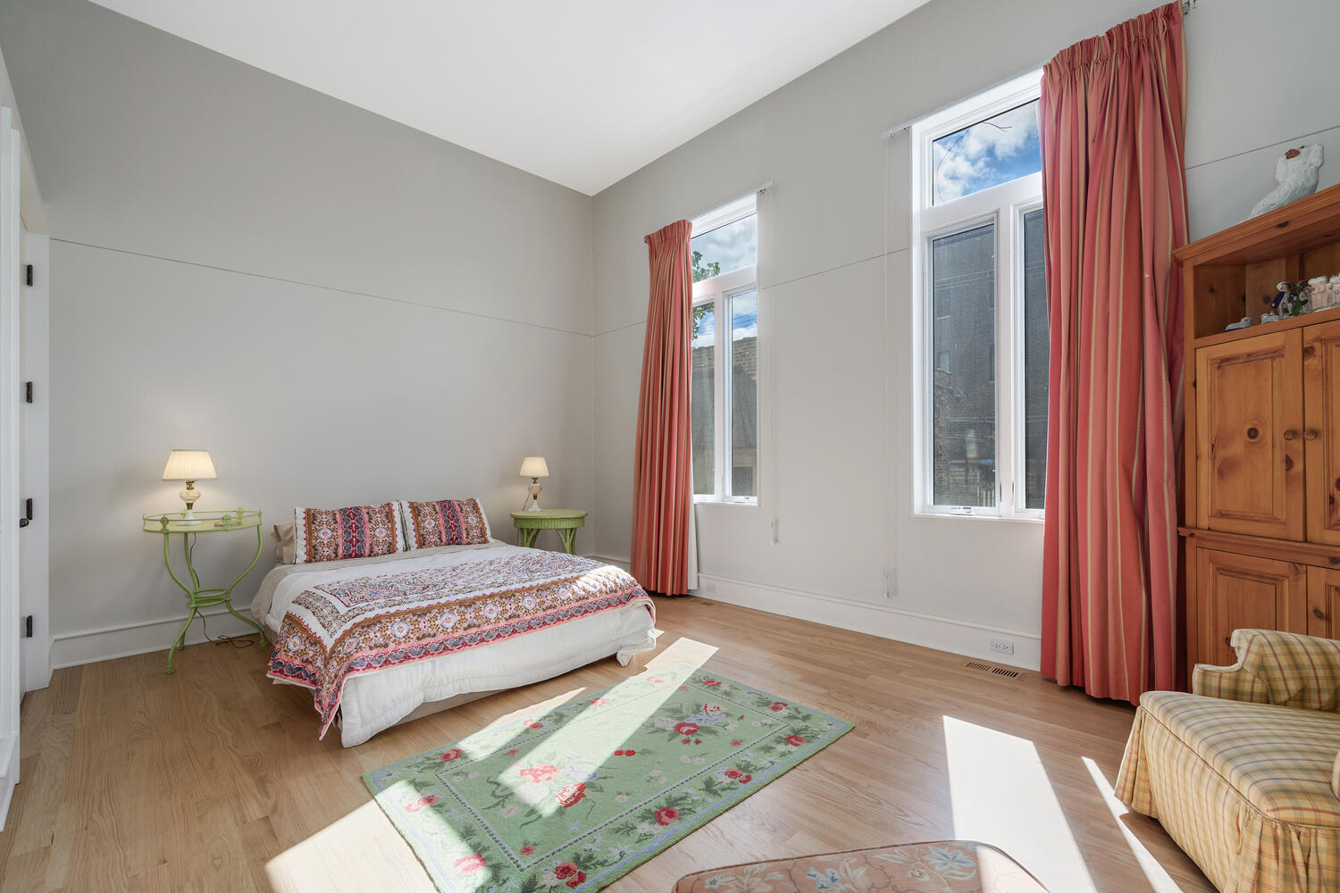 2214 North Burling Street Chicago, IL 60614 - Photo 18 of 29 a bedroom with a bed lamp and a large window