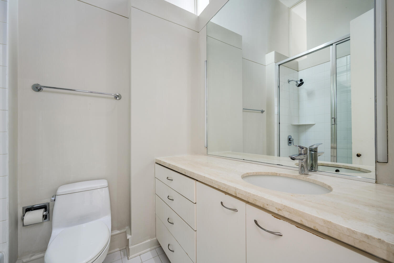 2214 North Burling Street Chicago, IL 60614 - Photo 20 of 29 a bathroom with a sink toilet vanity and shower