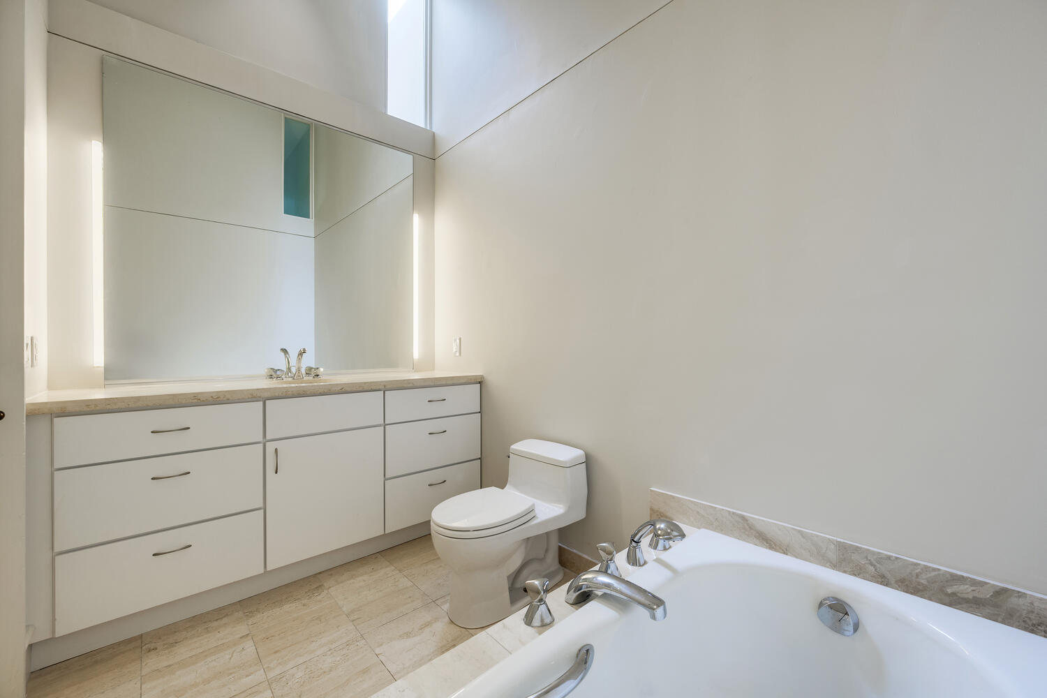 2214 North Burling Street Chicago, IL 60614 - Photo 23 of 29 a bathroom with a granite countertop toilet sink and mirror