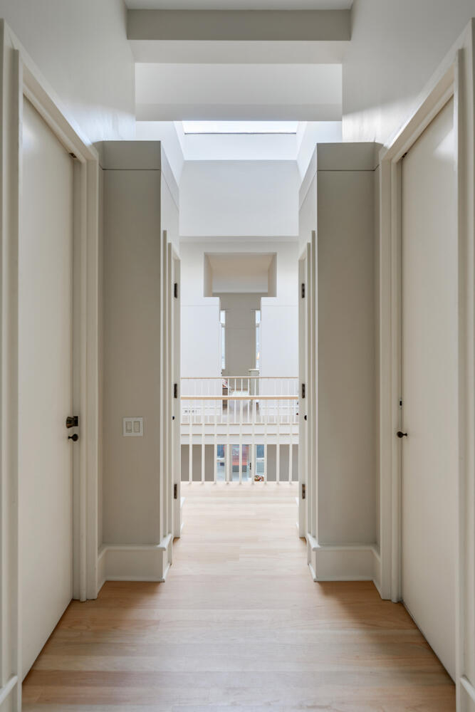 2214 North Burling Street Chicago, IL 60614 - Photo 25 of 29 a view of a hallway with wooden floor and a bathroom