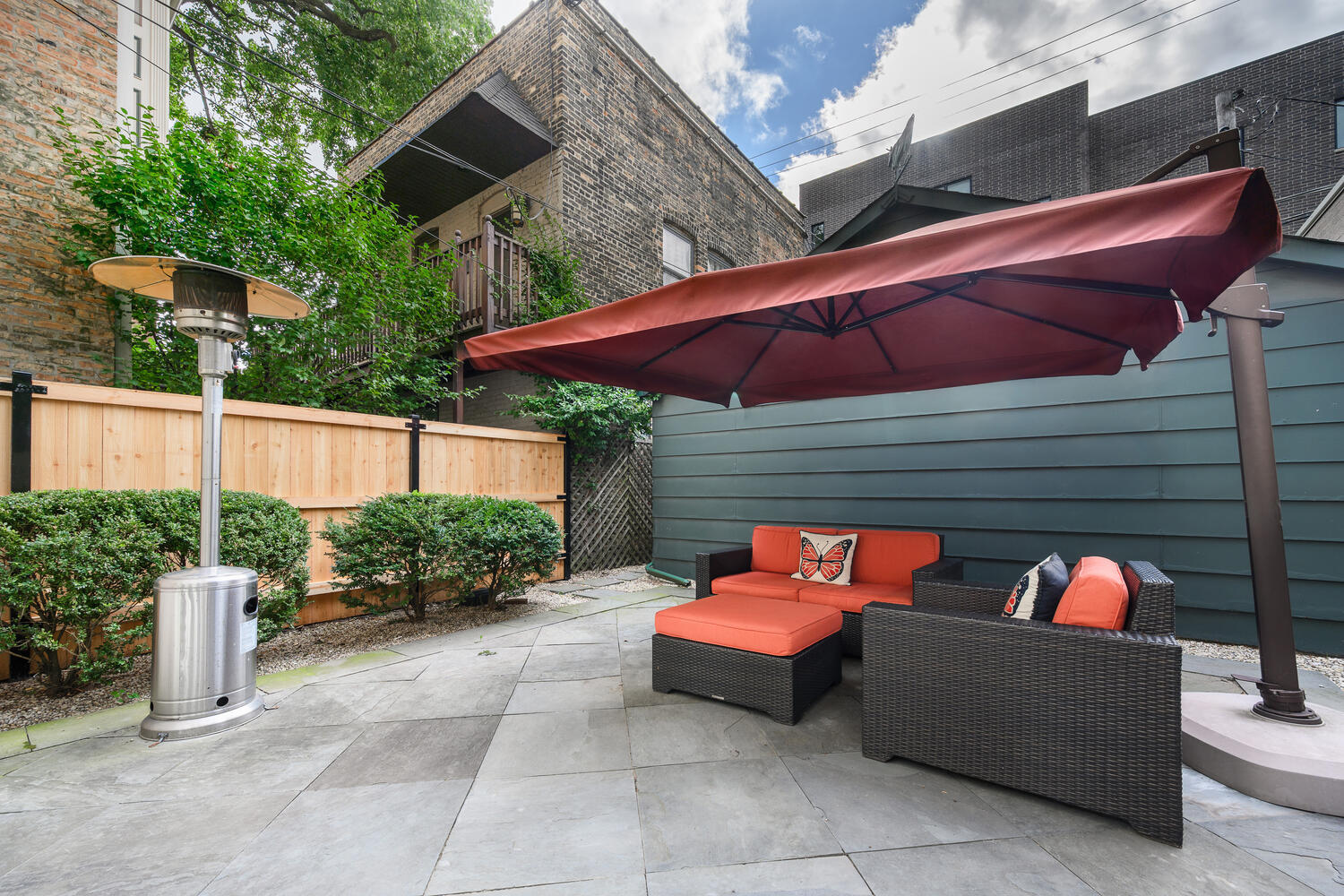 2214 North Burling Street Chicago, IL 60614 - Photo 27 of 29 a view of a patio with a table and chairs under an umbrella