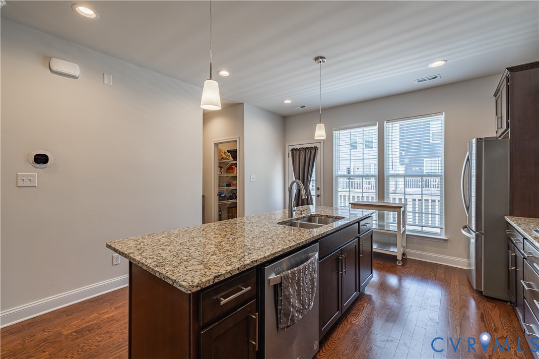 6929 Dunton Road Chesterfield, VA 23832 - Photo 9 of 28 Kitchen island featuring a patterned stone counter