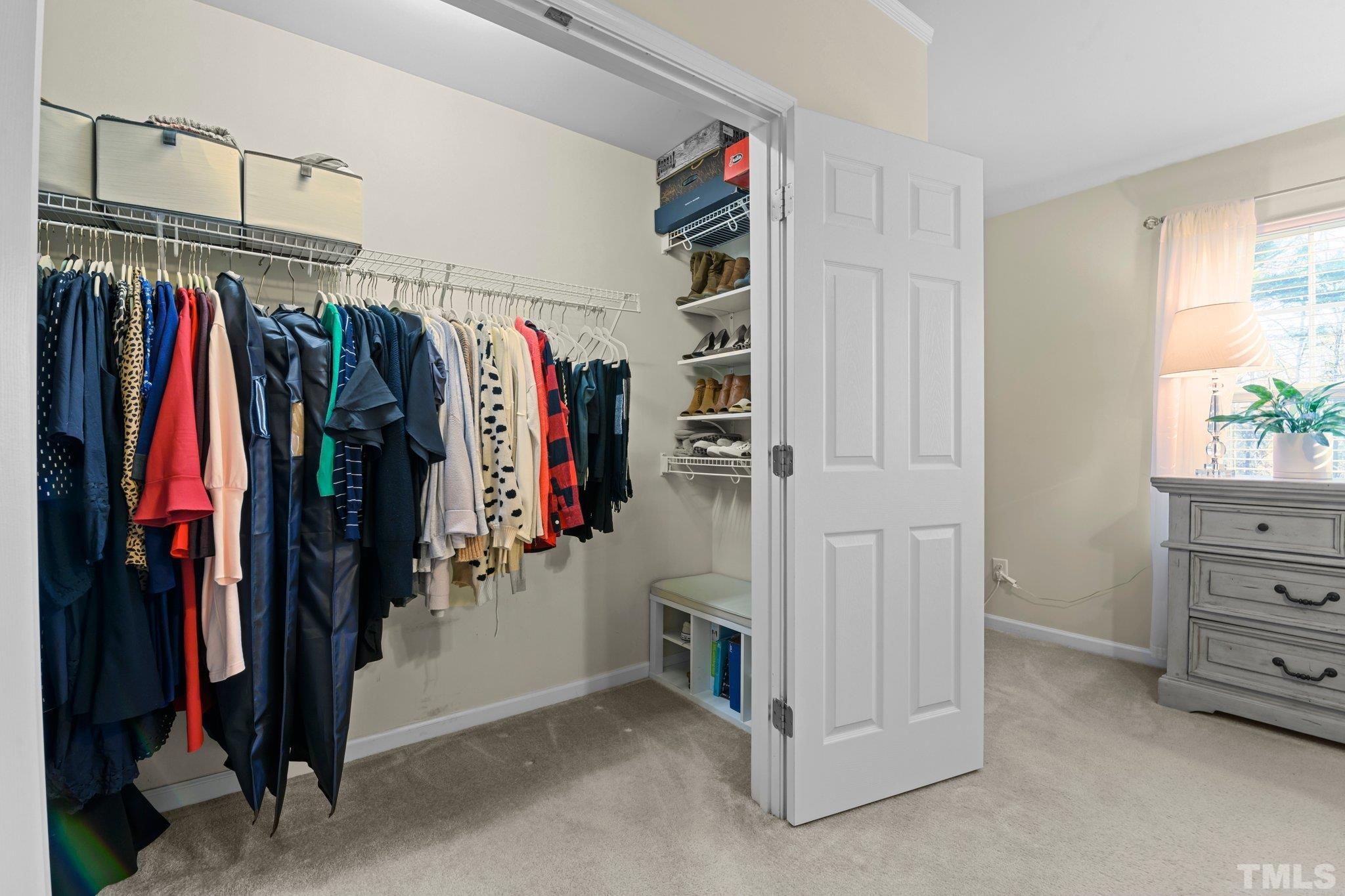 2842 Casona Way Raleigh, NC 27616 - Photo 15 of 27 a view of walk in closet with clothes