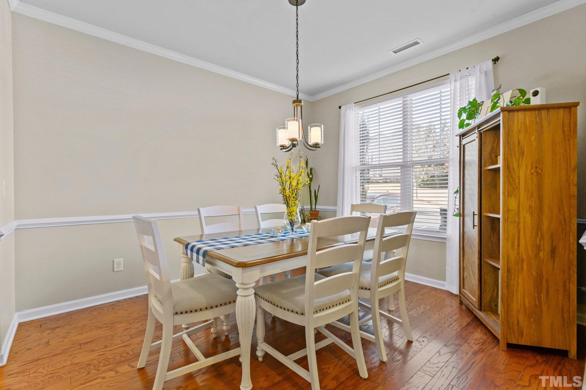 2842 Casona Way Raleigh, NC 27616 - Photo 3 of 27 a dining room with furniture and window