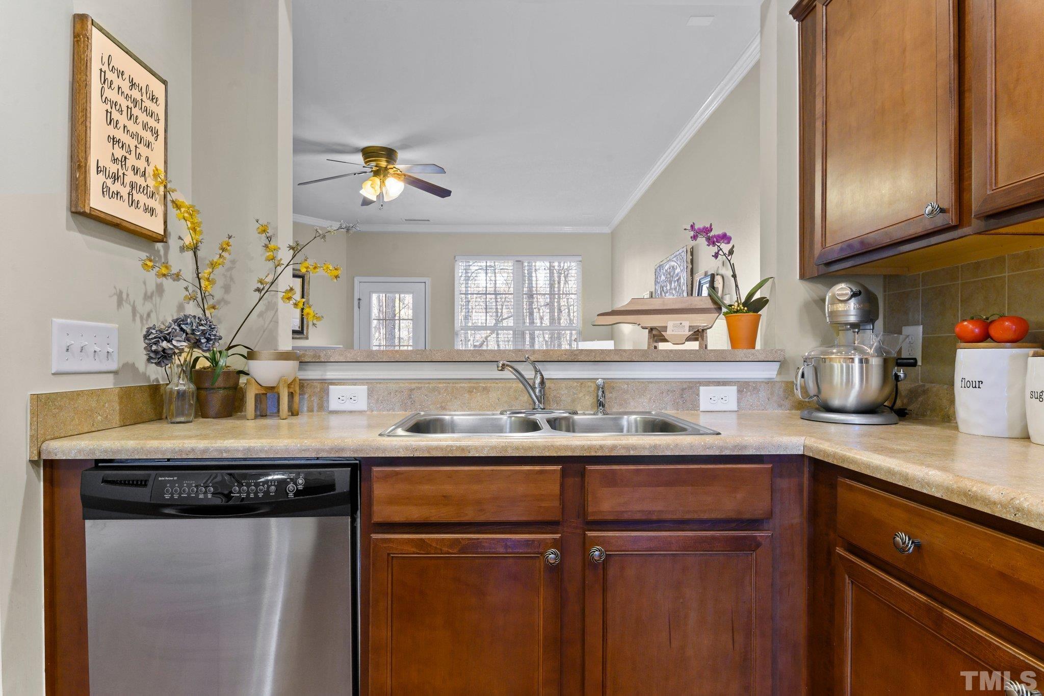 2842 Casona Way Raleigh, NC 27616 - Photo 5 of 27 a kitchen with granite countertop a sink cabinets and window