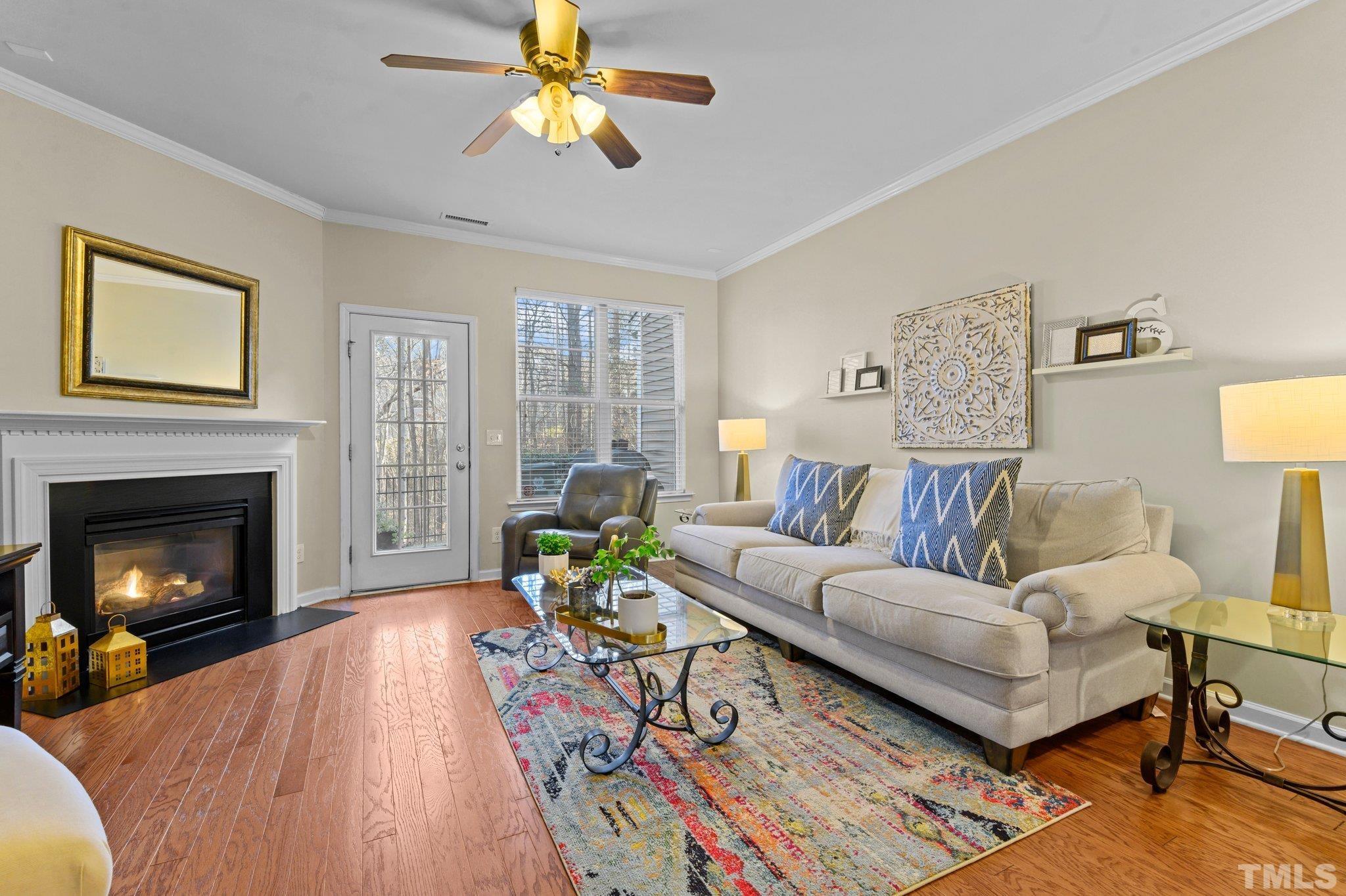 2842 Casona Way Raleigh, NC 27616 - Photo 8 of 27 a living room with furniture and a fireplace