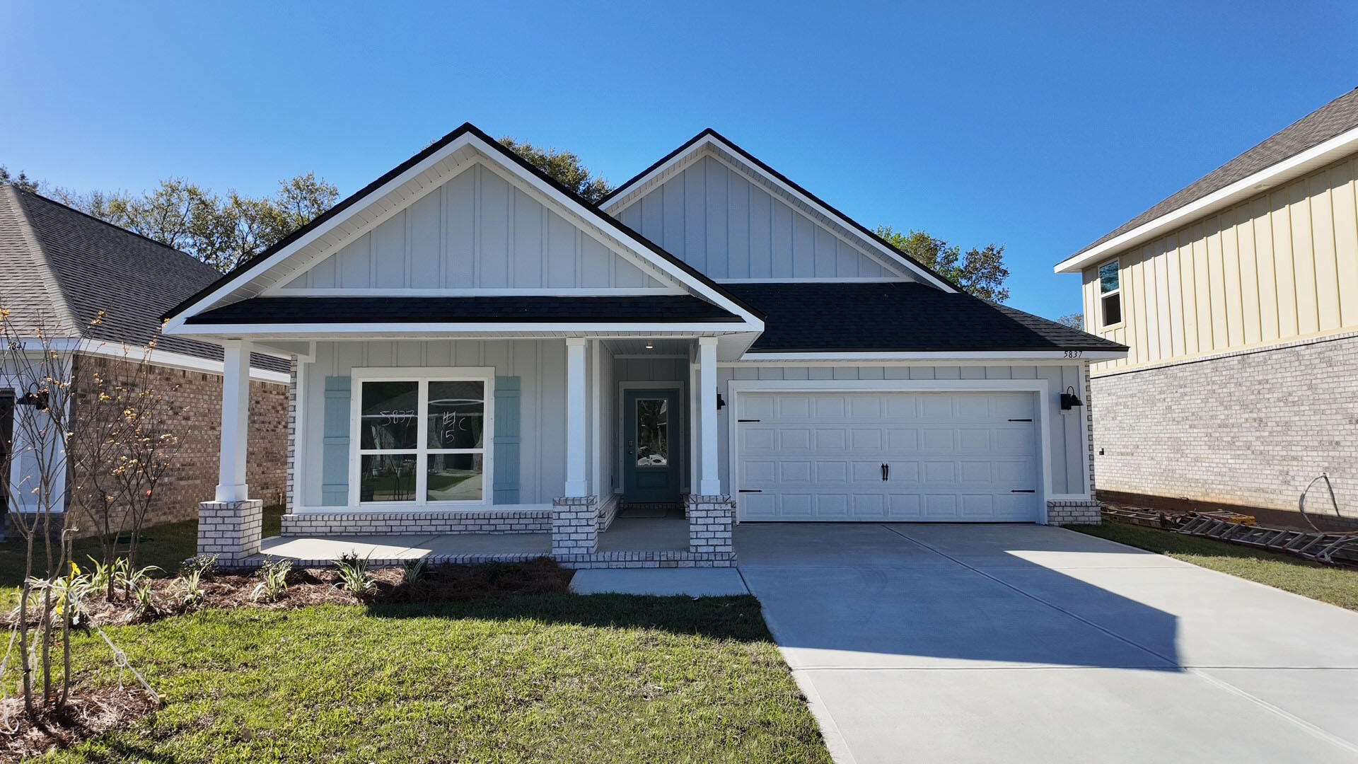 5837 Dove Nest Road Gulf Breeze, FL 32563 - Photo 1 of 32 a view of a house with a yard