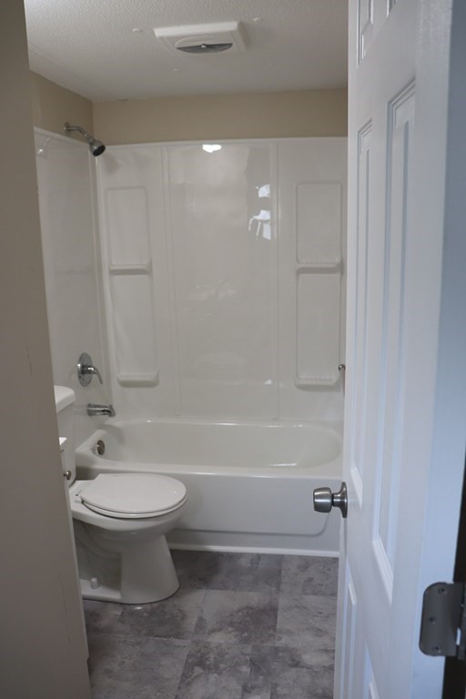 557 Southwest Cutoff, Unit 120 Worcester, MA 01607 - Photo 13 of 17 a bathroom with a sink a toilet and shower