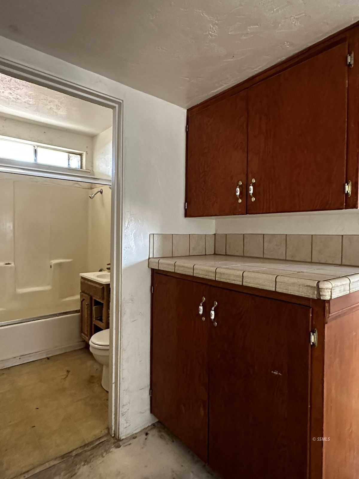 301 South Richmond Road Ridgecrest, CA 93555 - Photo 34 of 45 a bathroom with a sink and a mirror