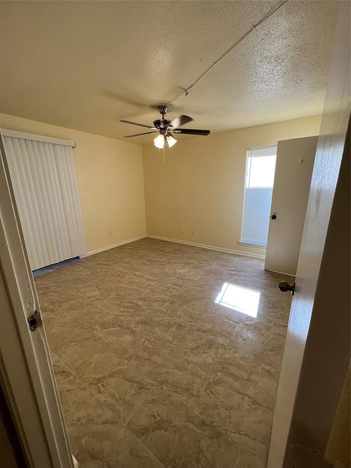 9000 Bissonnet Street, Unit 705 Houston, TX 77074 - Photo 16 of 18 wooden floor in an empty room with a window