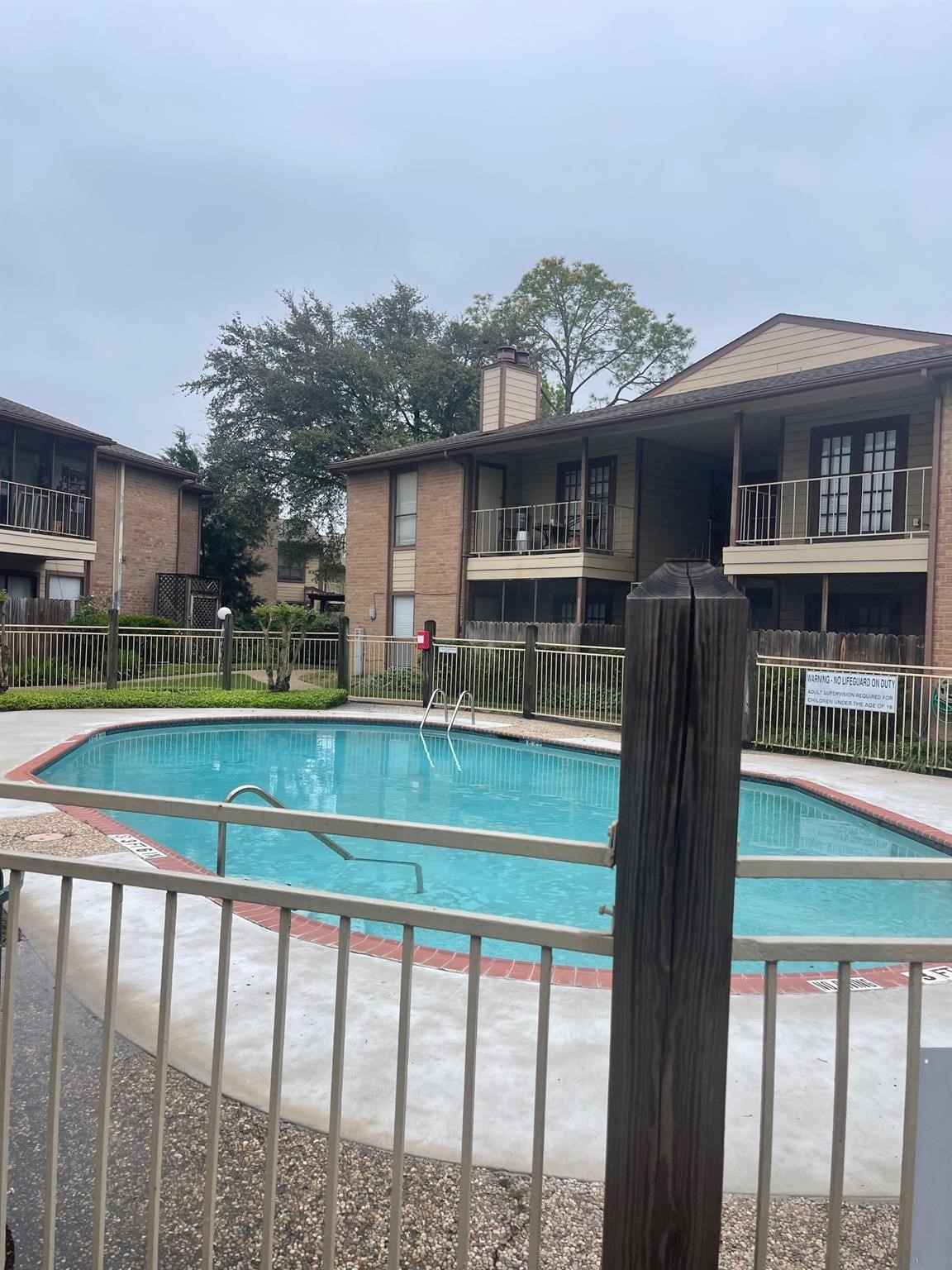 9000 Bissonnet Street, Unit 705 Houston, TX 77074 - Photo 4 of 18 a front view of a house with a yard