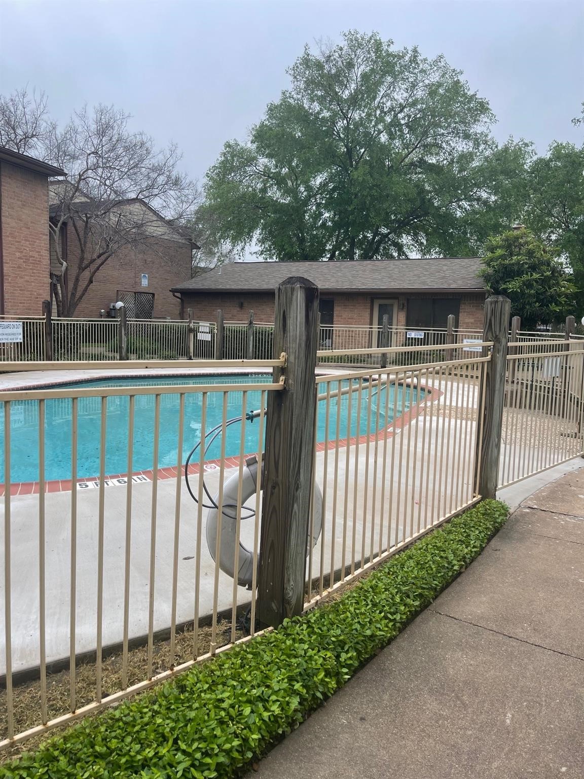 9000 Bissonnet Street, Unit 705 Houston, TX 77074 - Photo 5 of 18 a front view of a house with a garden