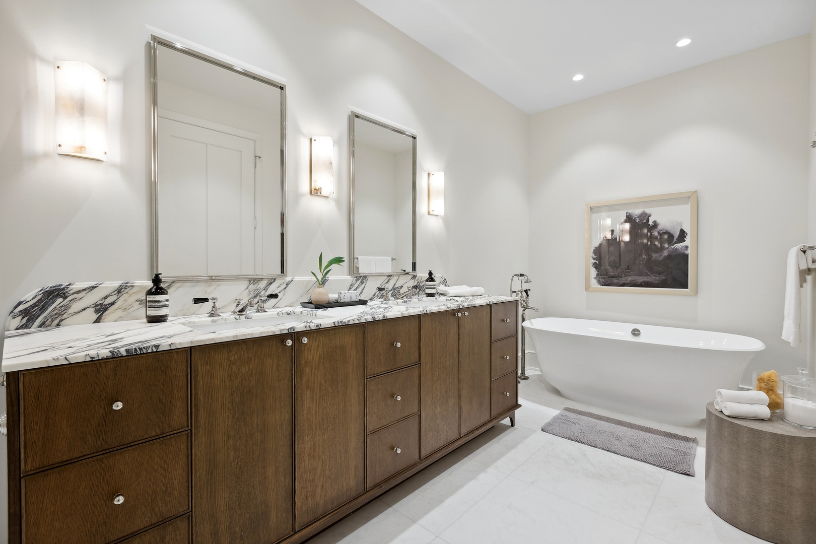 21 North May Street, Unit 301 Chicago, IL 60607 - Photo 28 of 35 a bathroom with a tub a double vanity sink and mirror