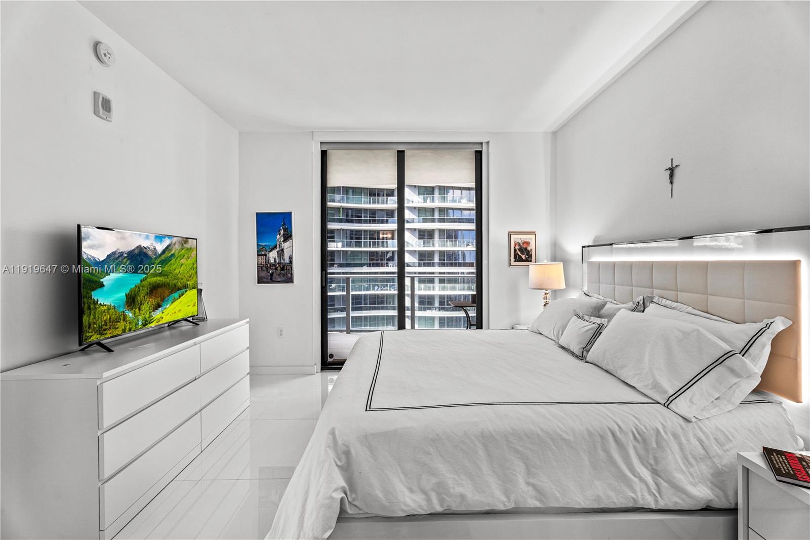 1010 Brickell Avenue, Unit 4206 Miami, FL 33131 - Photo 15 of 33 a bedroom with a bed and a flat screen tv