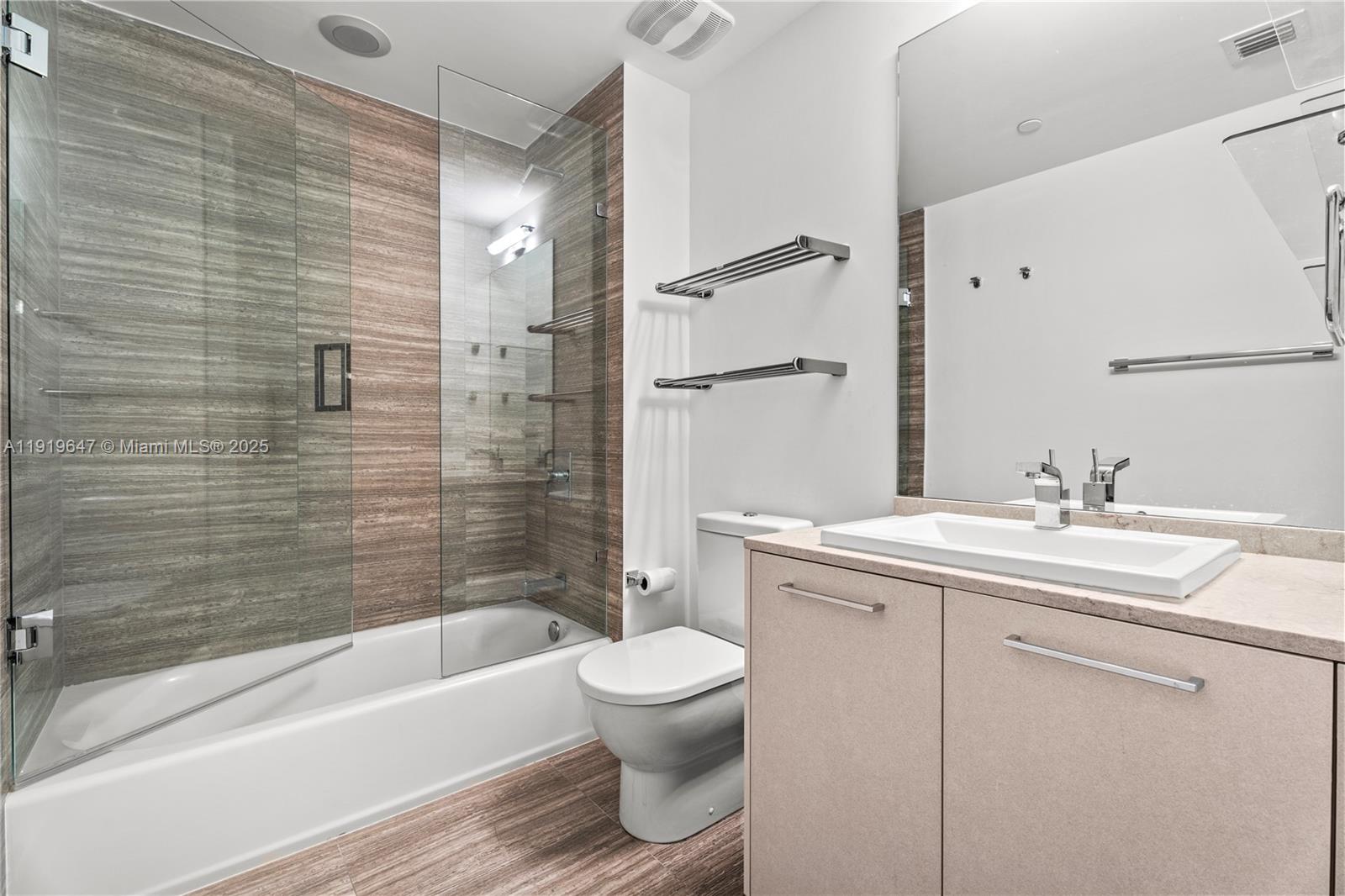 1010 Brickell Avenue, Unit 4206 Miami, FL 33131 - Photo 18 of 33 a bathroom with a sink toilet and shower