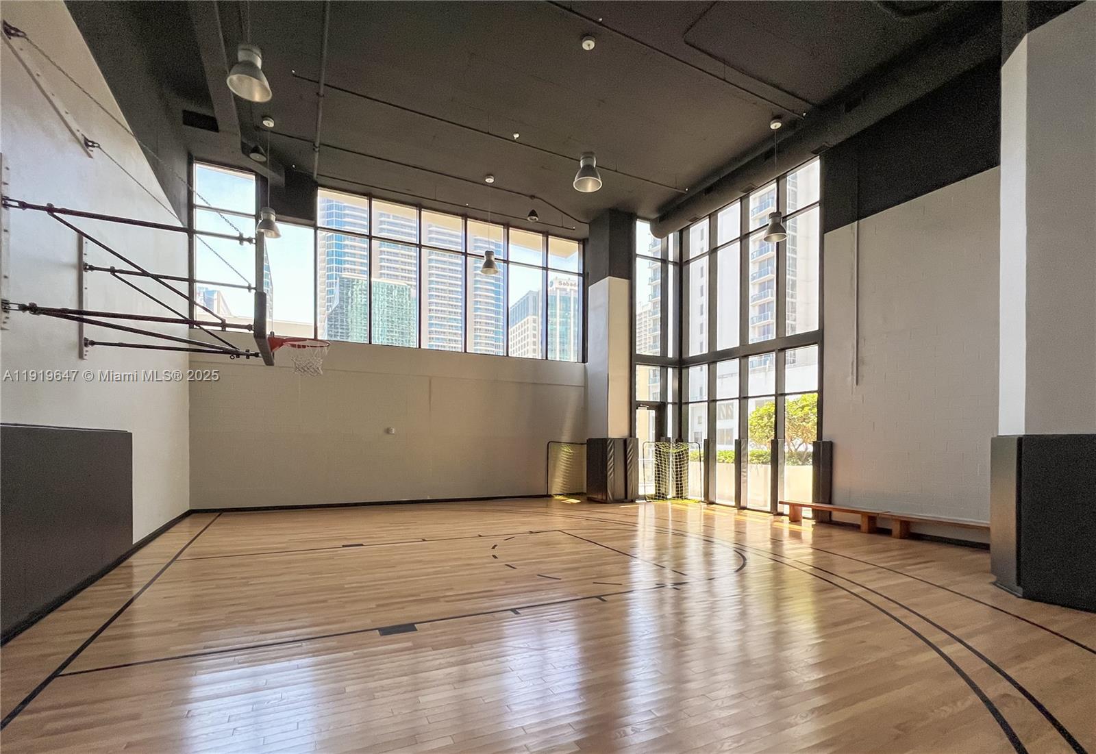 1010 Brickell Avenue, Unit 4206 Miami, FL 33131 - Photo 22 of 33 a view of an empty room with wooden floor and a window